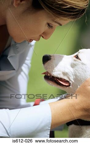 Dog with affectionate owner View Large Photo Image Stock Photograph - Dog with affectionate owner. Fotosearch