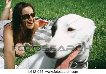 Picture - Dog with happy lady owner. Fotosearch