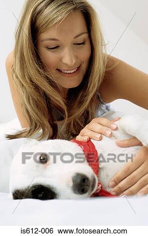 Stock Photograph - Dog with smiling lady owner. Fotosearch