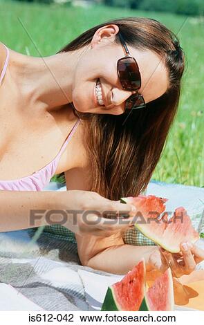 Woman enjoying watermelon View Large Photo Image Stock Image - Woman enjoying watermelon. Fotosearch