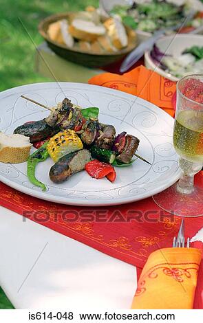 Stock Photo - Al fresco meal with wine. Fotosearch