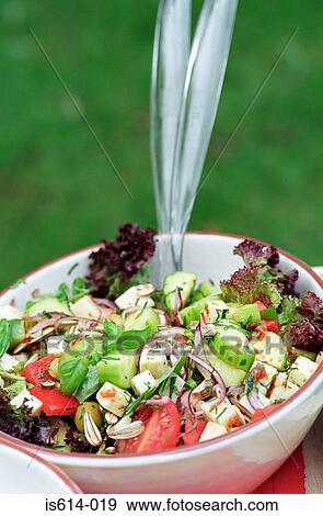 Stock Photo - Bowl of salad outdoors.. Fotosearch