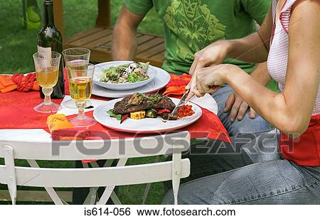 Couple eating lunch outdoors. View Large Photo Image Stock Photograph - Couple eating lunch outdoors.. Fotosearch