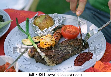 Cutting steak on plate. View Large Photo Image Stock Image - Cutting steak on plate.. Fotosearch