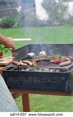 Food grilling on barbeque View Large Photo Image Stock Photo - Food grilling on barbeque. Fotosearch