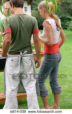 Friends at a barbeque meal. View Large Photo Image Stock Photo - Friends at a barbeque meal.. Fotosearch