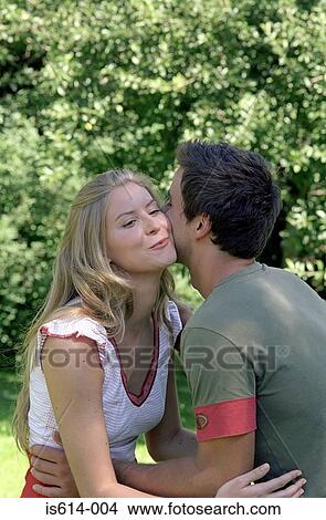 Friends hugging outdoors. View Large Photo Image Picture - Friends hugging outdoors.. Fotosearch