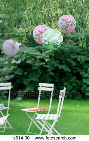 Garden chairs under lampshades. View Large Photo Image Stock Image - Garden chairs under lampshades.. Fotosearch