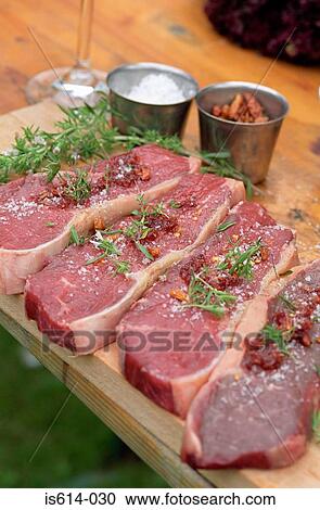 Grilling steaks with herbs. View Large Photo Image Stock Image - Grilling steaks with herbs.. Fotosearch