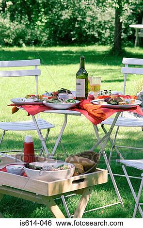 Lunch in the garden with wine. View Large Photo Image Stock Photograph - Lunch in the garden with wine.. Fotosearch