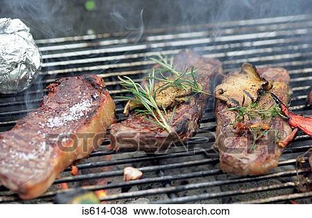 Meat grilling on barbeque. View Large Photo Image Stock Photo - Meat grilling on barbeque.. Fotosearch