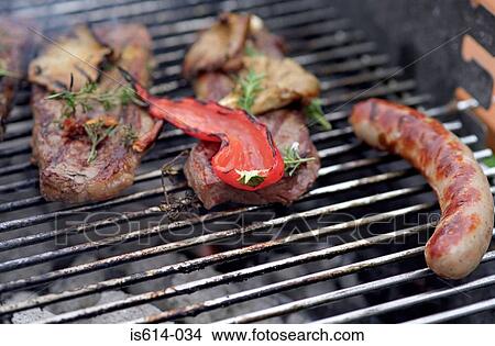 Meat roasting on barbeque View Large Photo Image Picture - Meat roasting on barbeque. Fotosearch