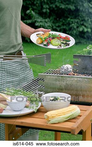 Serving a barbeque meal. View Large Photo Image Stock Photography - Serving a barbeque meal.. Fotosearch