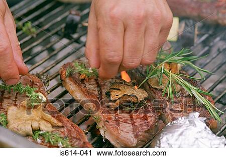 Stock Image - Steaks seasoned to barbeque. Fotosearch