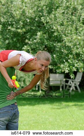 Stock Photo - Young couple fooling outdoors.. Fotosearch