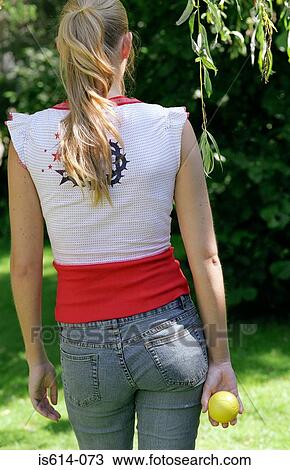 Stock Image - Young woman seen from behind.. Fotosearch