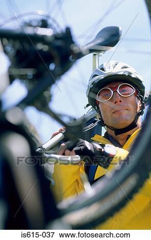 Stock Photo - Close-up of bike with cyclist.. Fotosearch