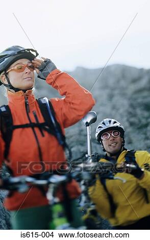 Picture - Cyclists look at route ahead.. Fotosearch