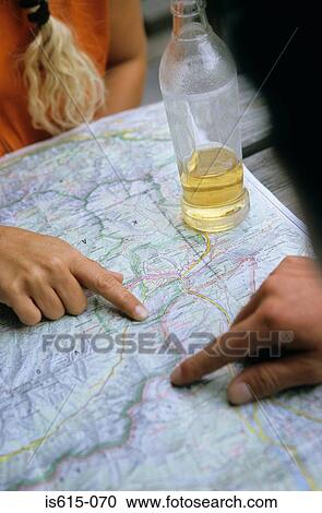 Mapping the route with a drink. View Large Photo Image Stock Image - Mapping the route with a drink.. Fotosearch