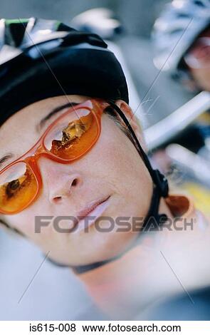 Stock Photo - Portrait of female cyclist.. Fotosearch