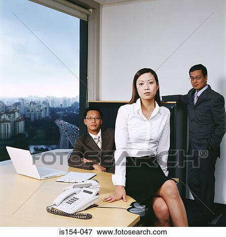 Asian businesspeople in office View Large Photo Image Stock Photo - Asian businesspeople in office. Fotosearch