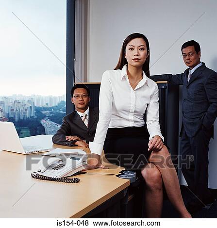 Stock Photo - Asian businesspeople in office. Fotosearch