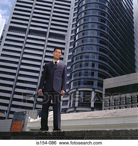 Businessman and skyscrapers View Large Photo Image Stock Photograph - Businessman and skyscrapers. Fotosearch