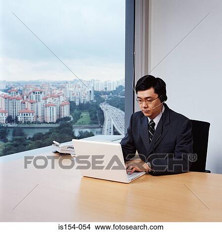 Businessman using laptop computer View Large Photo Image Picture - Businessman using laptop computer. Fotosearch