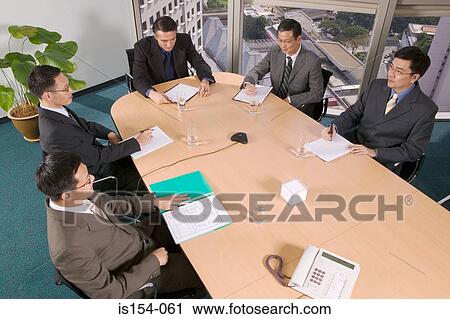 Businessmen in conference room View Large Photo Image Stock Image - Businessmen in conference room. Fotosearch