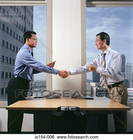 Businessmen shaking hands View Large Photo Image Stock Photograph - Businessmen shaking hands. Fotosearch