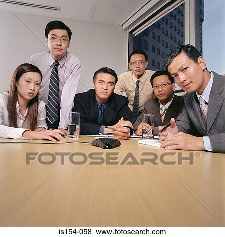 Businesspeople having a conference call View Large Photo Image Stock Photo - Businesspeople having a conference call. Fotosearch