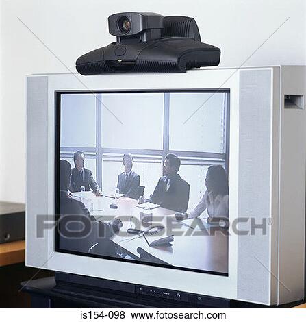 Businesspeople having video conference View Large Photo Image Stock Photo - Businesspeople having video conference. Fotosearch