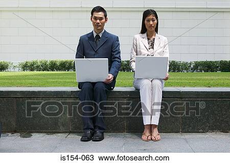 Businesspeople using laptop computers View Large Photo Image Stock Image - Businesspeople using laptop computers. Fotosearch