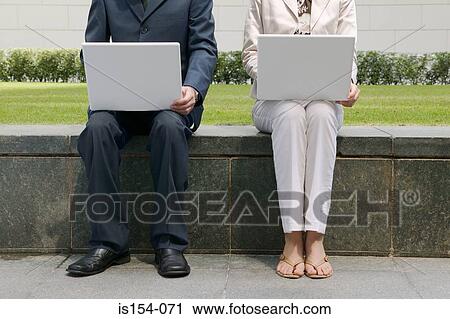 Businesspeople using laptop computers View Large Photo Image Stock Image - Businesspeople using laptop computers. Fotosearch