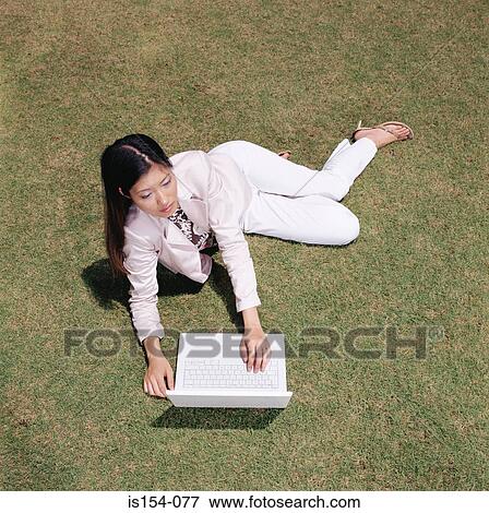 Businesswoman working in field View Large Photo Image Stock Photo - Businesswoman working in field. Fotosearch