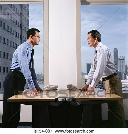 Stock Photo - Hostile looking businessmen. Fotosearch