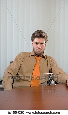 Stock Image - Angry looking businessman. Fotosearch