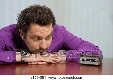 Stock Image - Bored looking office worker. Fotosearch