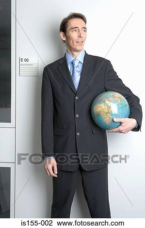 Businessman holding globe View Large Photo Image Stock Image - Businessman holding globe. Fotosearch