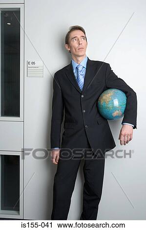 Businessman holding globe View Large Photo Image Stock Image - Businessman holding globe. Fotosearch