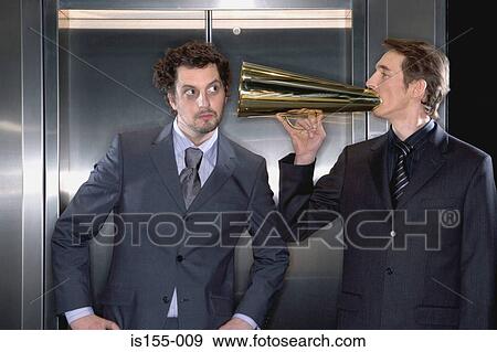 Stock Photo - Businessman using a megaphone. Fotosearch