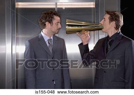 Businessman using a megaphone View Large Photo Image Stock Photo - Businessman using a megaphone. Fotosearch