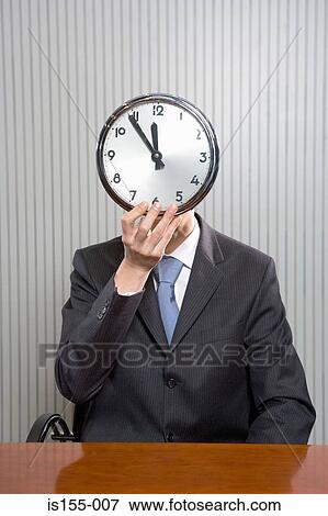 Businessman with a clock face View Large Photo Image Stock Photo - Businessman with a clock face. Fotosearch