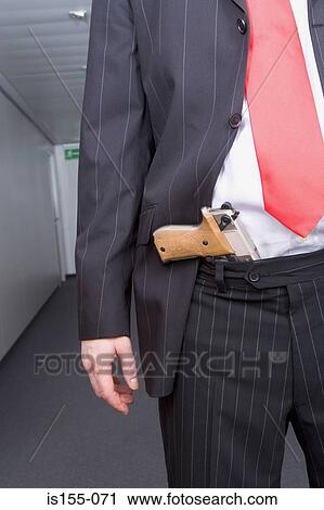 Businessman with a handgun View Large Photo Image Stock Image - Businessman with a handgun. Fotosearch