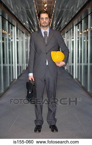 Businessman with hard hat View Large Photo Image Stock Image - Businessman with hard hat. Fotosearch