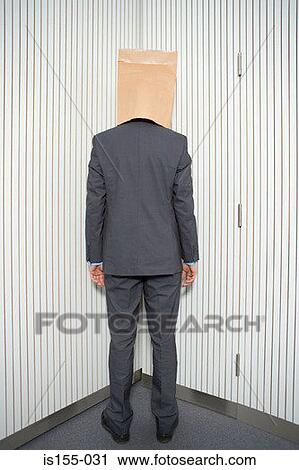 Stock Image - Businessman with paper bag on head. Fotosearch
