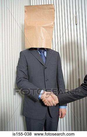 Businessman with paper bag on head View Large Photo Image Stock Photo - Businessman with paper bag on head. Fotosearch