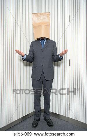 Stock Photo - Businessman with paper bag on head. Fotosearch