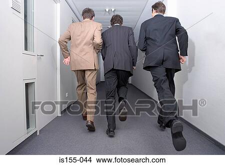 Businessmen running in corridor View Large Photo Image Picture - Businessmen running in corridor. Fotosearch