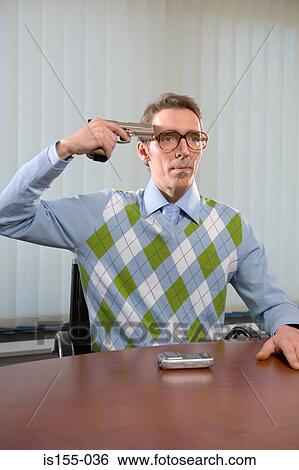Stock Photograph - Man holding gun to head. Fotosearch